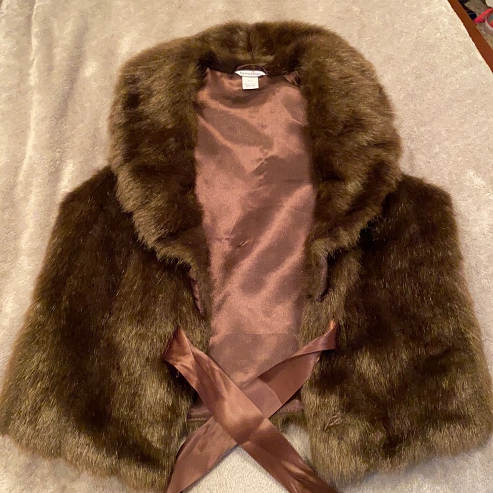 this is a brown fur vest size 7/8